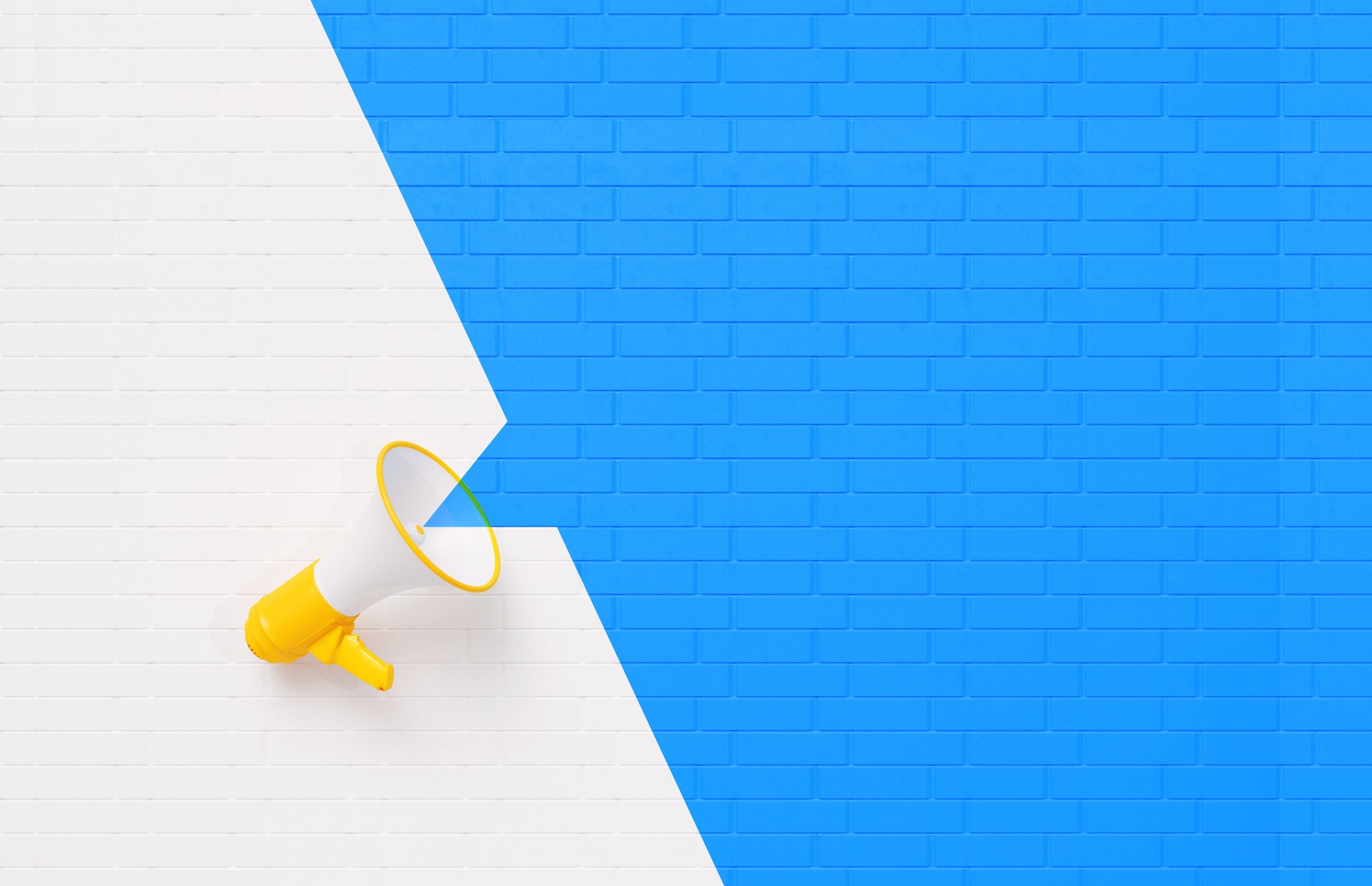 Yellow Megaphone on White and Blue Wall Background